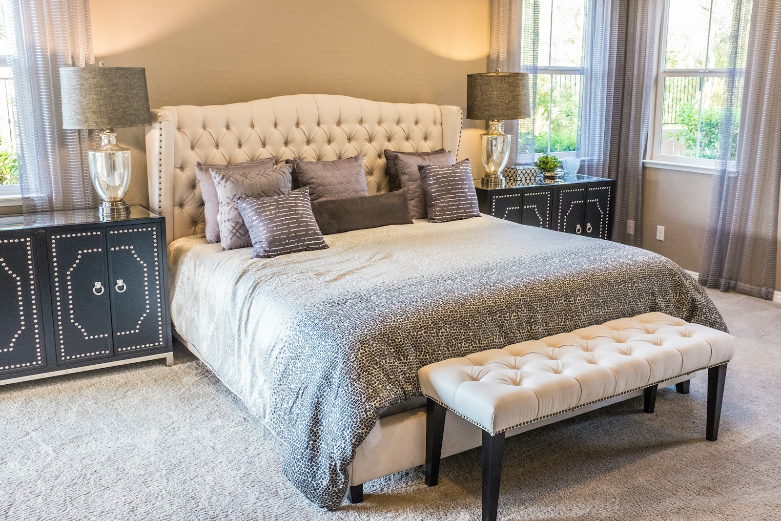 B1 two bedroom interior, a primary bedroom with large windows