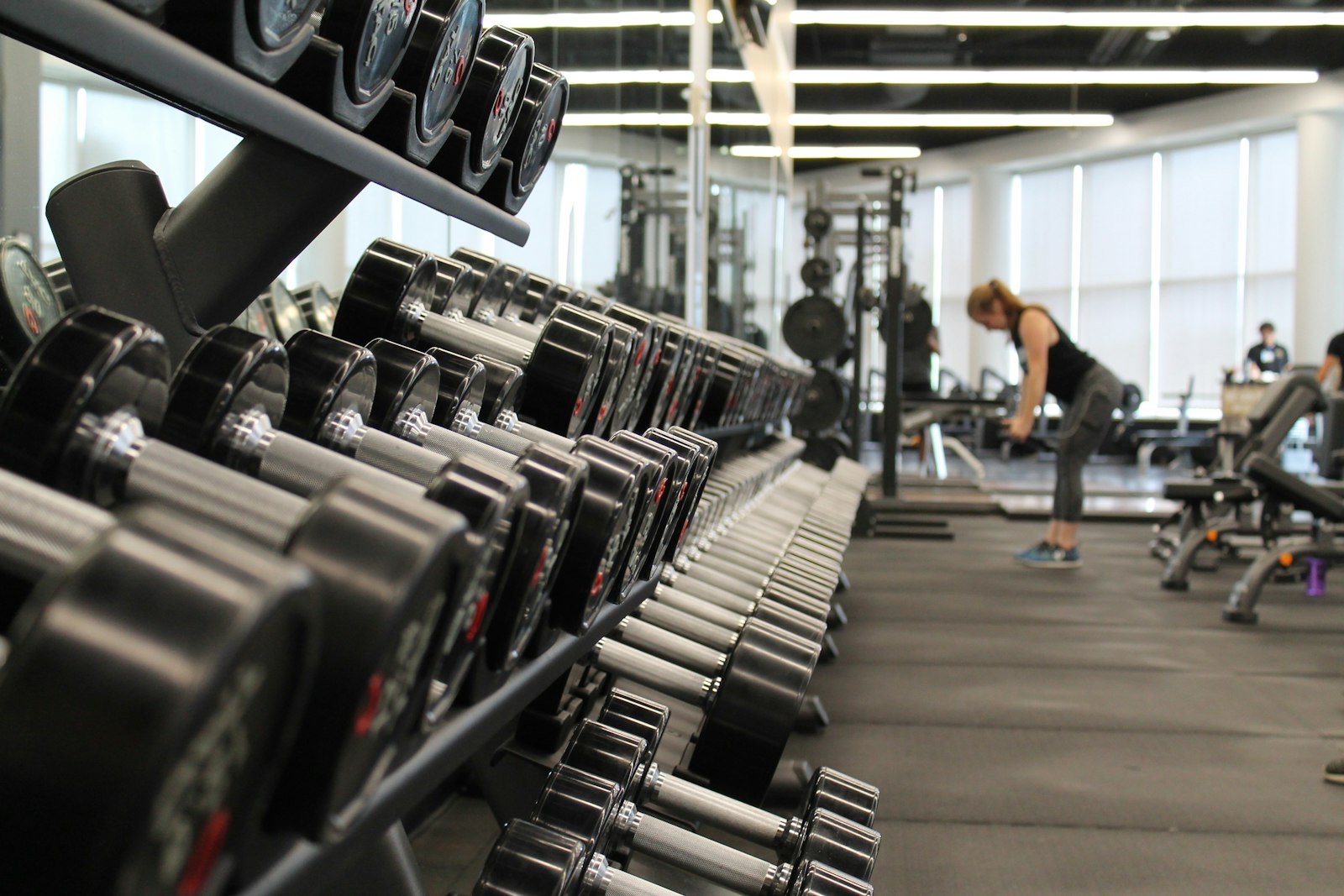 Fitness studio with free weights and Peloton bikes